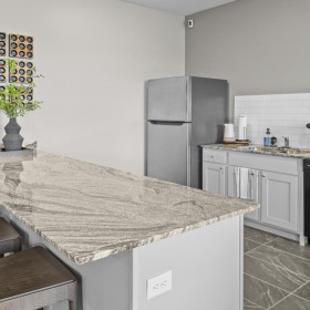 a kitchen with a granite counter