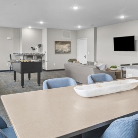 a room with a table and chairs