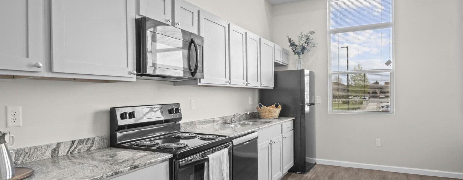 a kitchen with white cabinets