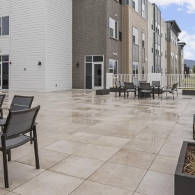 a building with tables and chairs outside